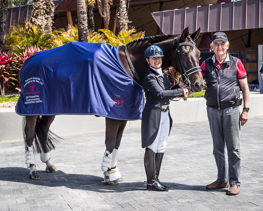 Terry Snow standing with the winner of the CDI 2* Grand Prix Terry Snow standing with the winner of the CDI 2* Grand Prix